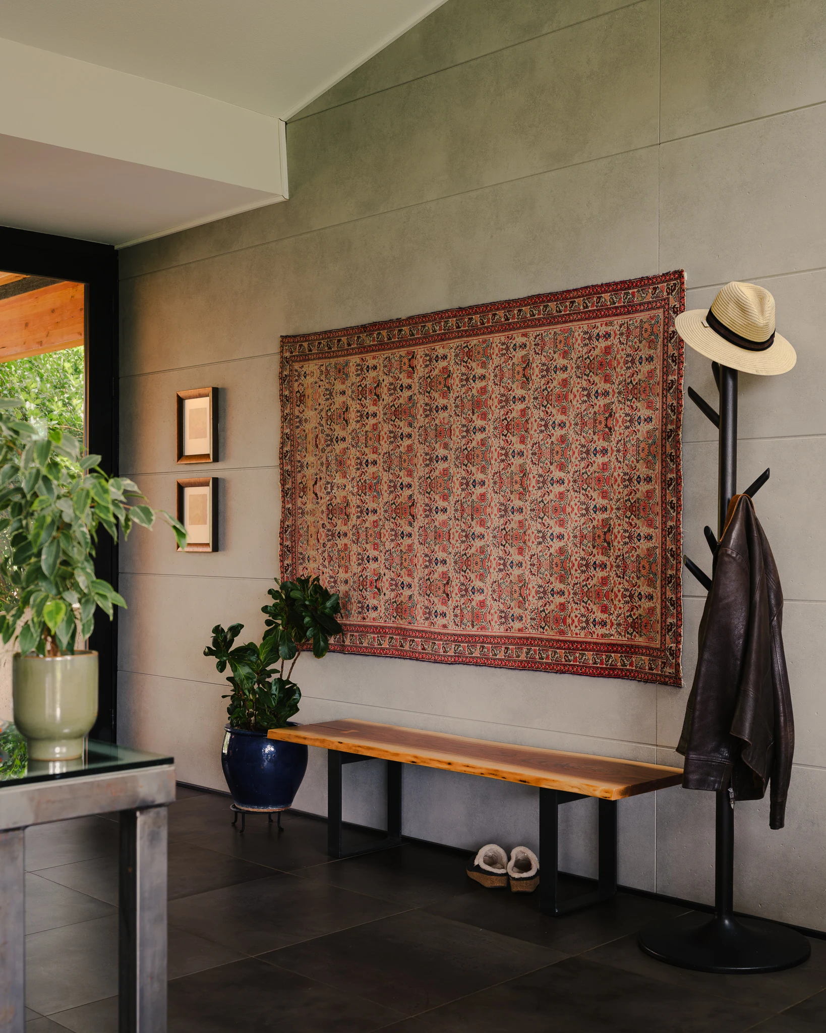 Entry bench and coat rack styled with a hat and leather jacket — interior design photography Bozeman Montana, Living Places Design Studio